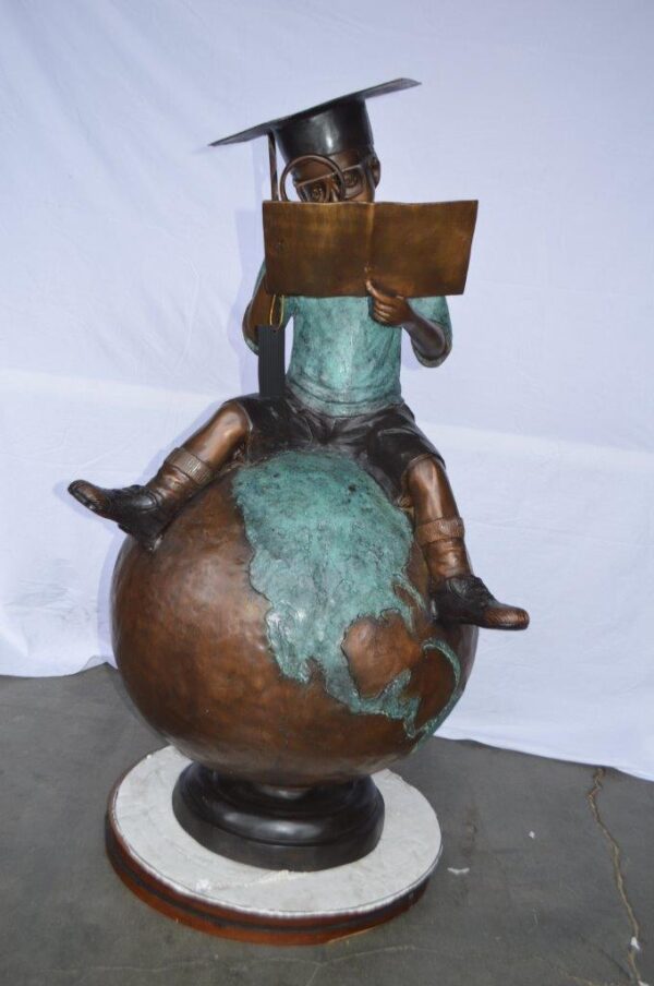 Student learning on top of world bronze statue -  Size: 28"L x 24"W x 52"H. - Image 2