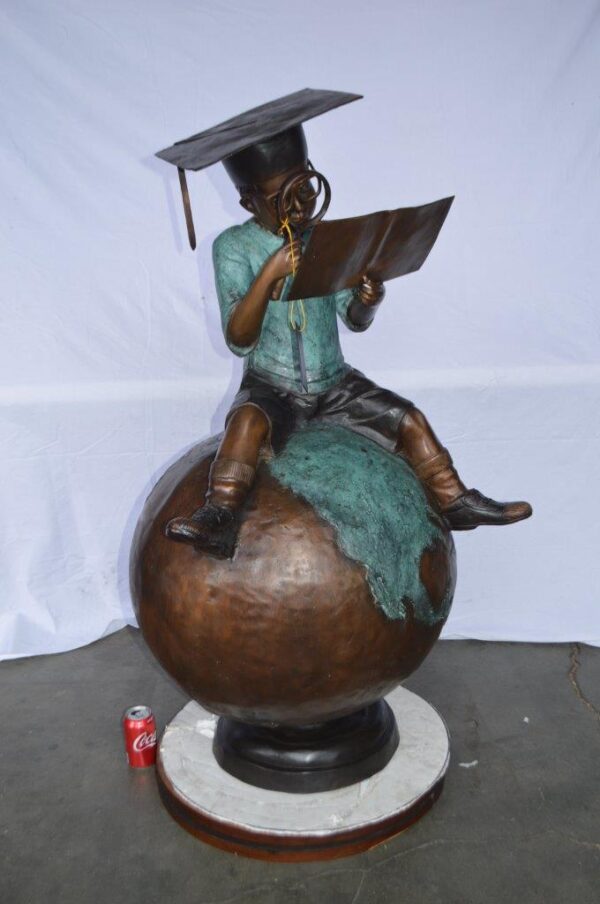 Student learning on top of world bronze statue -  Size: 28"L x 24"W x 52"H. - Image 3
