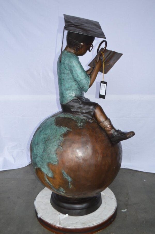 Student learning on top of world bronze statue -  Size: 28"L x 24"W x 52"H. - Image 5