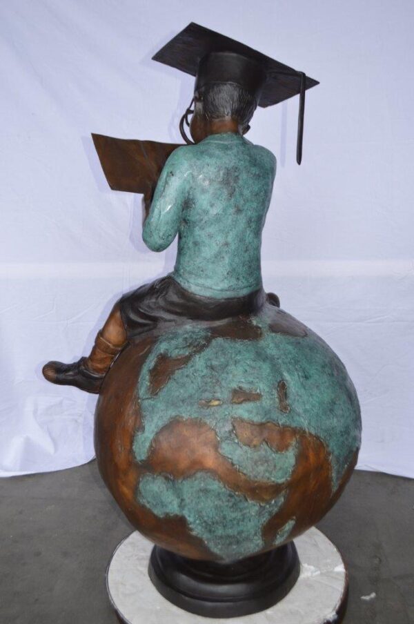 Student learning on top of world bronze statue -  Size: 28"L x 24"W x 52"H. - Image 7