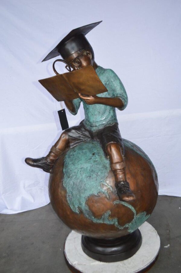 Student learning on top of world bronze statue -  Size: 28"L x 24"W x 52"H. - Image 10