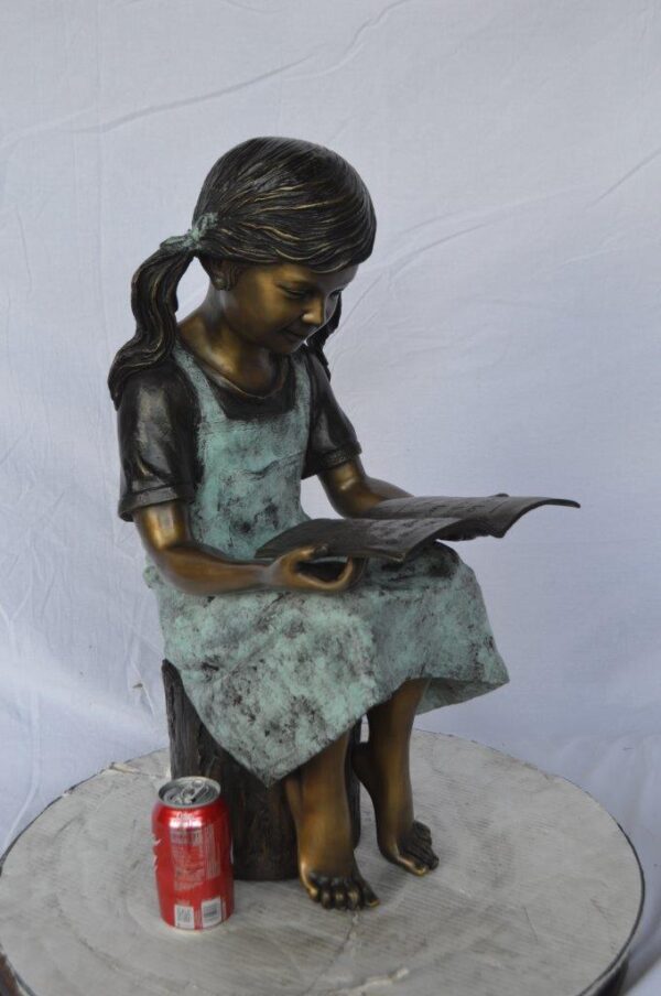Young girl sitting and reading book bronze statue -  Size: 16"L x 12"W x 27"H. - Image 3