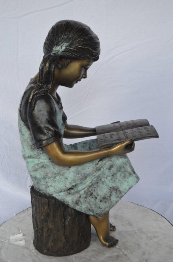 Young girl sitting and reading book bronze statue -  Size: 16"L x 12"W x 27"H. - Image 4