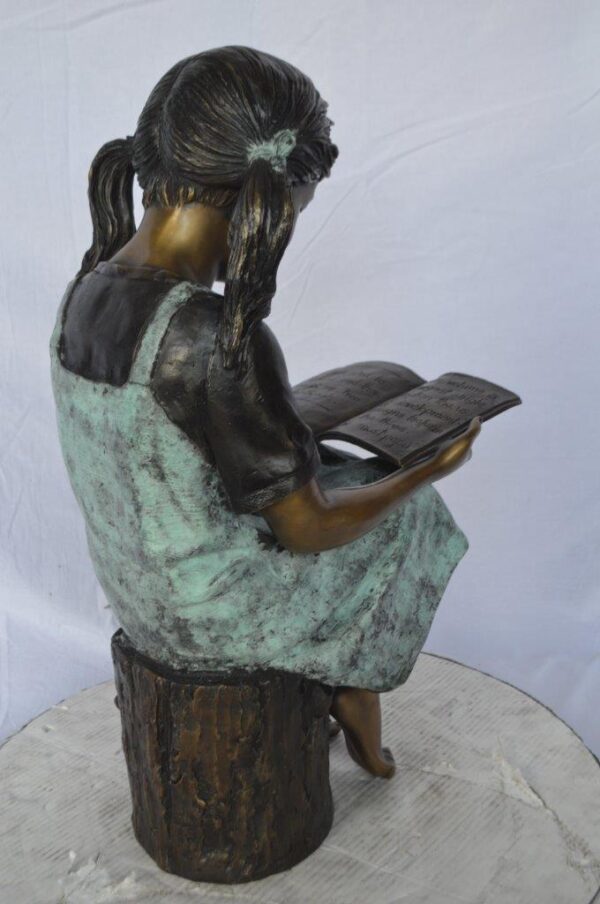 Young girl sitting and reading book bronze statue -  Size: 16"L x 12"W x 27"H. - Image 5