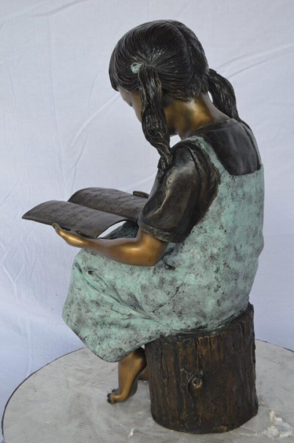 Young girl sitting and reading book bronze statue -  Size: 16"L x 12"W x 27"H. - Image 8