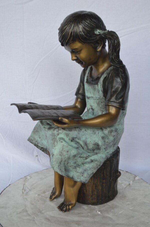 Young girl sitting and reading book bronze statue -  Size: 16"L x 12"W x 27"H. - Image 9