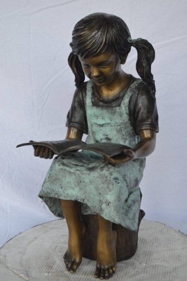 Young girl sitting and reading book bronze statue -  Size: 16"L x 12"W x 27"H. - Image 10