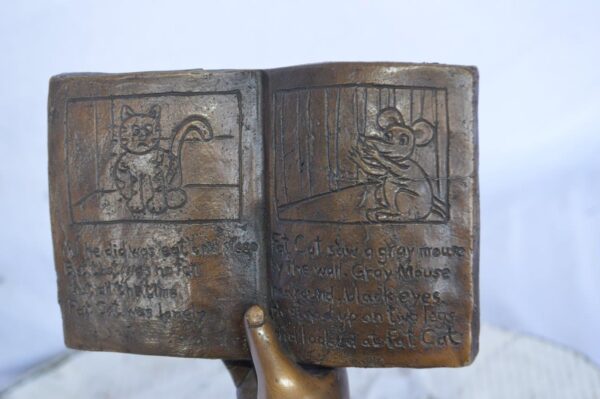 Young girl laying and reading book bronze statue -  Size: 18"L x 9"W x 16"H. - Image 12