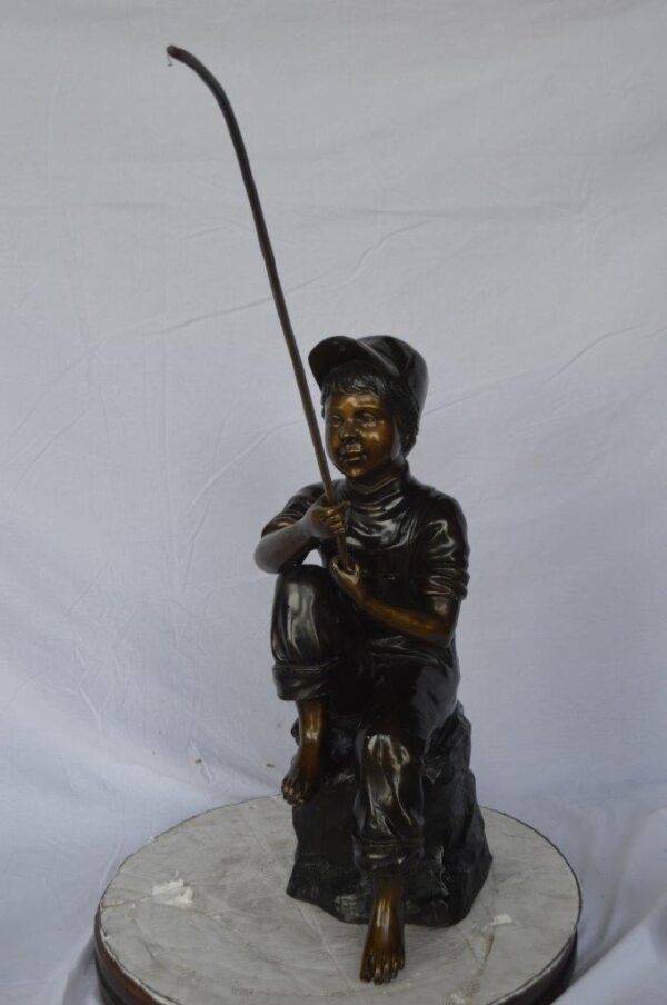 Young Boy sitting on a rock fishing bronze statue -  Size: 31"L x 9"W x 33"H. - Image 2