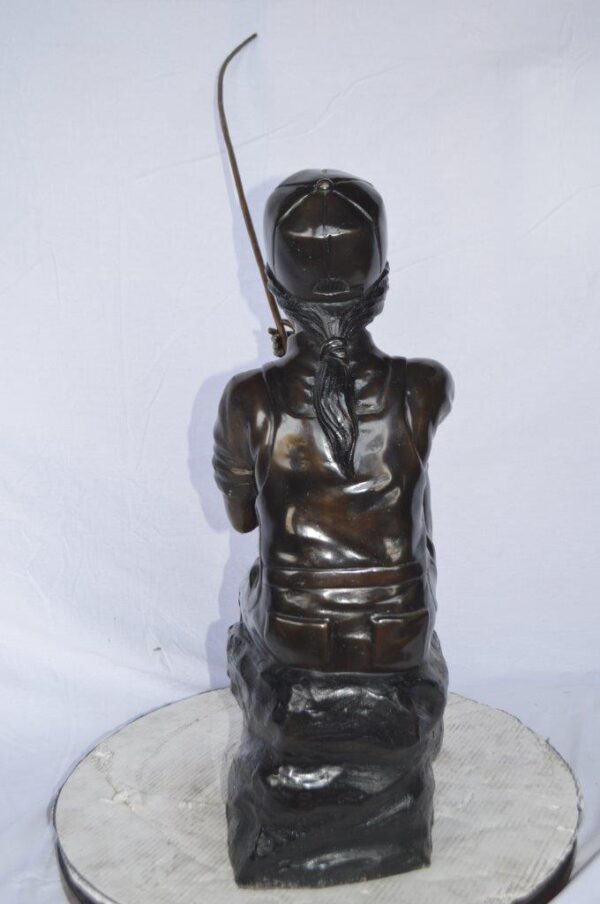 Young Boy sitting on a rock fishing bronze statue -  Size: 31"L x 9"W x 33"H. - Image 8