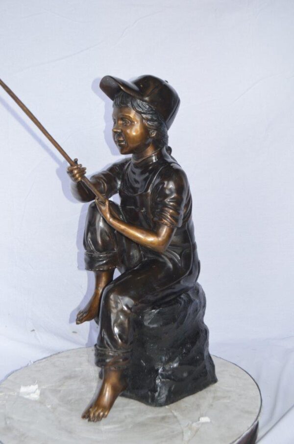 Young Boy sitting on a rock fishing bronze statue -  Size: 31"L x 9"W x 33"H. - Image 10