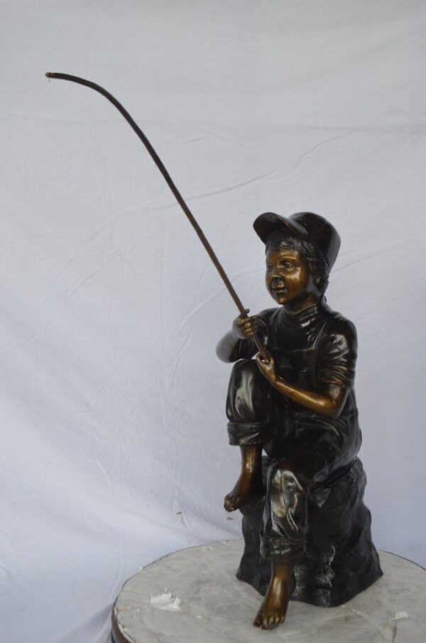 Young Boy sitting on a rock fishing bronze statue -  Size: 31"L x 9"W x 33"H. - Image 11