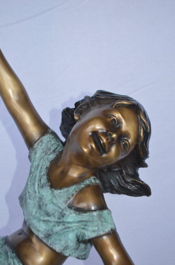 Girl having fun on apple bronze statue -  Size: 22"L x 9"W x 31"H. - Image 3
