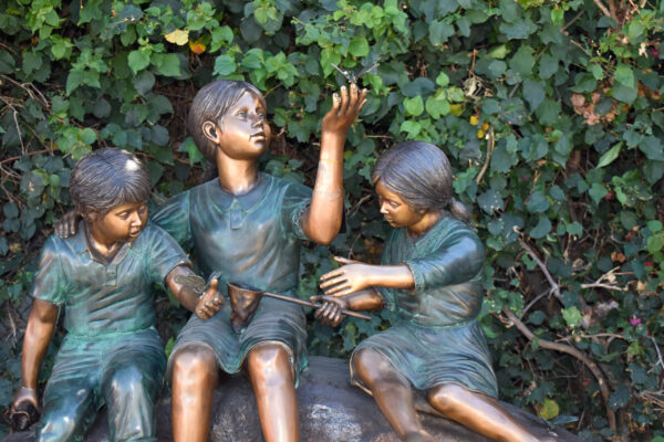 Three Kids Playing With Butterflies Bronze Statue -  Size: 70"L x 25"W x 45"H. - Image 4