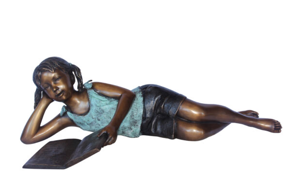 Peaceful young girl enjoying a read bronze statue -  Size: 40"L x 17"W x 13"H.