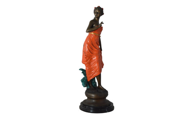 Young lady in orange bronze statue - Size: 7"L x 26"W x 25"H.