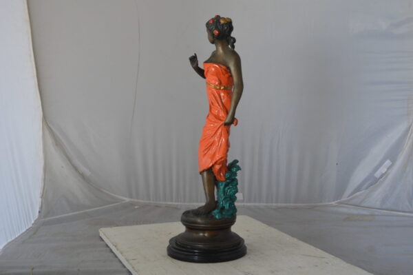 Young lady in orange bronze statue - Size: 7"L x 26"W x 25"H. - Image 5