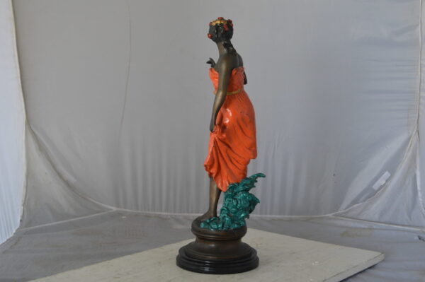 Young lady in orange bronze statue - Size: 7"L x 26"W x 25"H. - Image 7