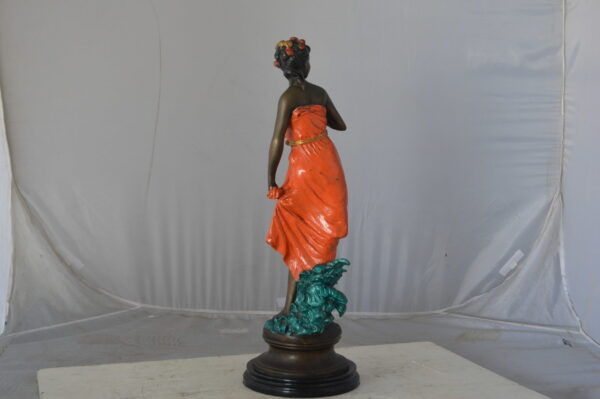Young lady in orange bronze statue - Size: 7"L x 26"W x 25"H. - Image 8