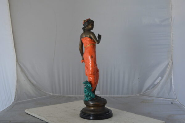 Young lady in orange bronze statue - Size: 7"L x 26"W x 25"H. - Image 10