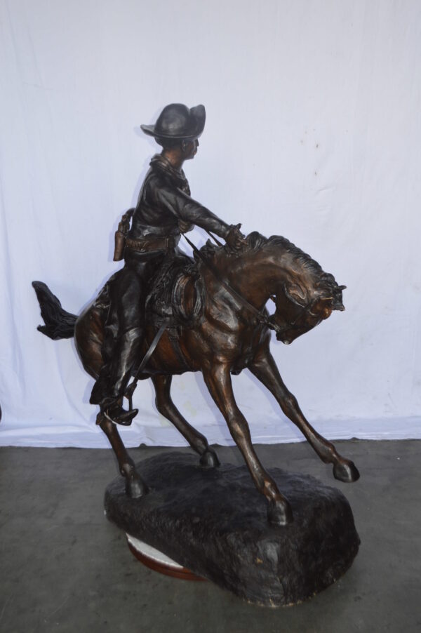 Giant Cowboy Remington bronze statue - Size: 66"L x 30"W x 58"H. - Image 8