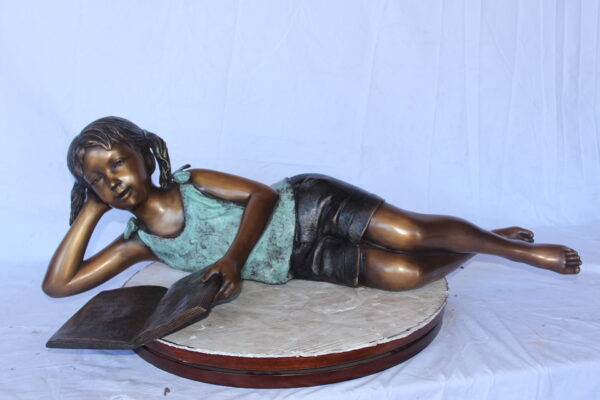 Peaceful young girl enjoying a read bronze statue -  Size: 40"L x 17"W x 13"H. - Image 3