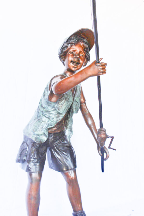 A young boy and his fishing journey bronze statue -  Size: 24"L x 26"W x 47"H. - Image 5