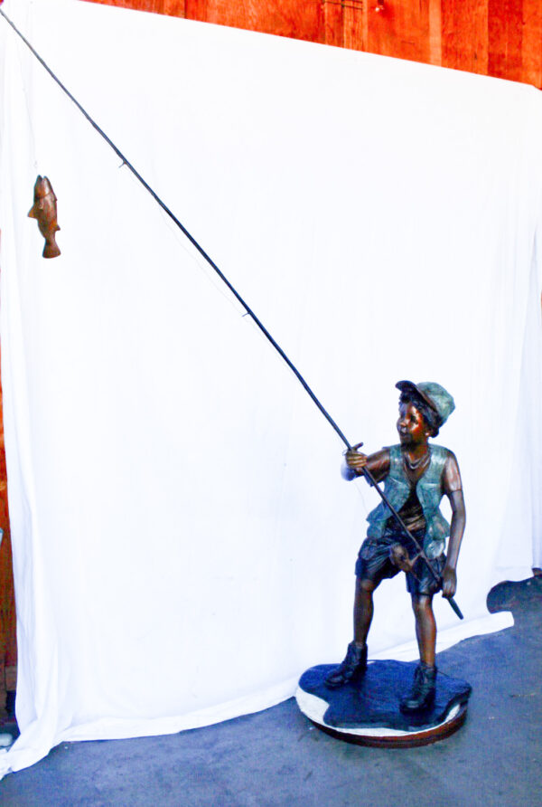 A young boy and his fishing journey bronze statue -  Size: 24"L x 26"W x 47"H. - Image 10