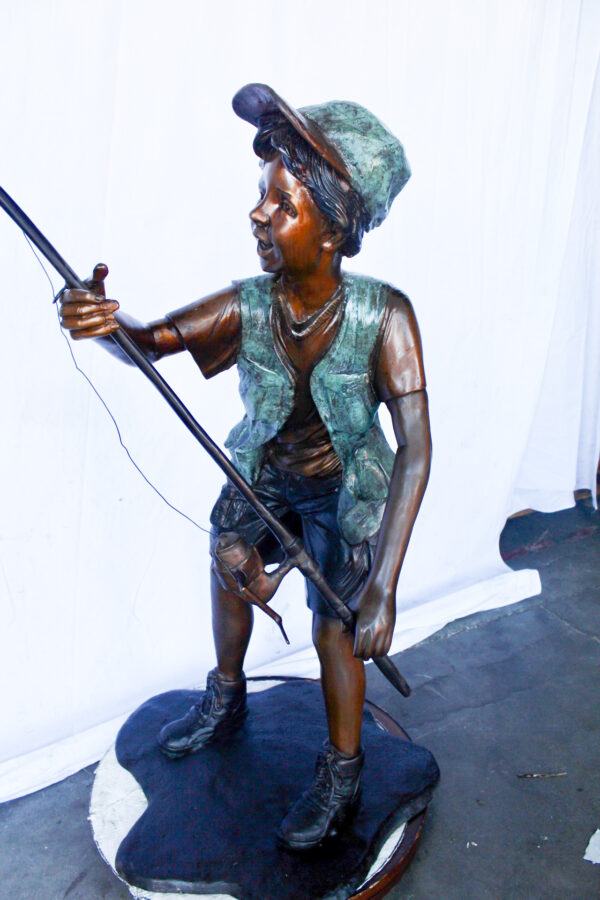 A young boy and his fishing journey bronze statue -  Size: 24"L x 26"W x 47"H. - Image 11