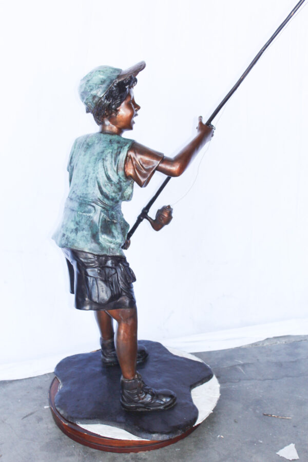A young boy and his fishing journey bronze statue -  Size: 24"L x 26"W x 47"H. - Image 13