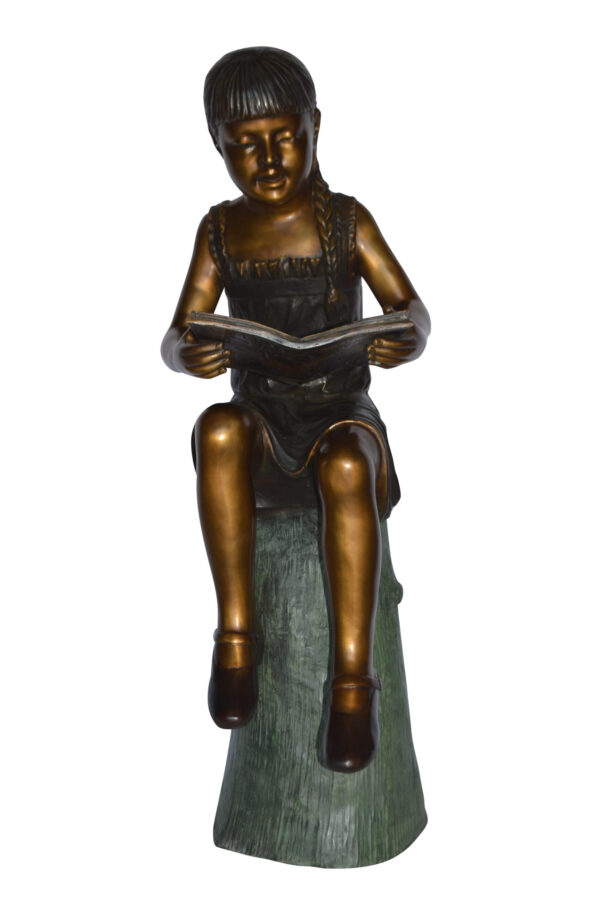 Girl Sitting on a Tree Stump, Reading Bronze Statue - Size: 15"L x 20"W x 22"H.