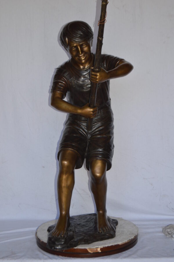 A Young Boy Fishing Bronze Statue - Size: 16"L x 54"W x 62"H. - Image 4