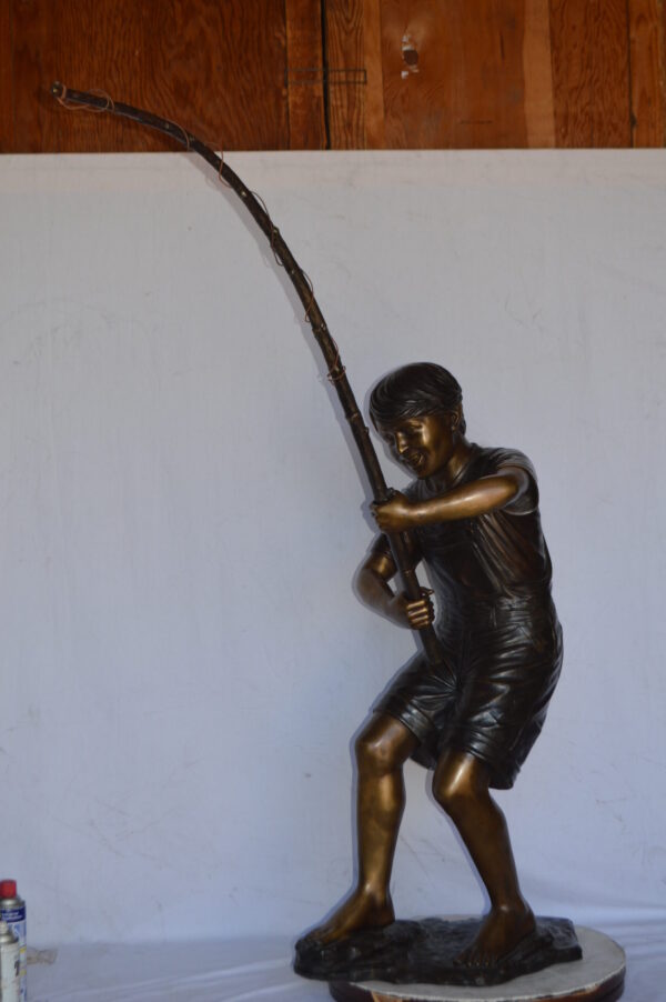 A Young Boy Fishing Bronze Statue - Size: 16"L x 54"W x 62"H. - Image 6