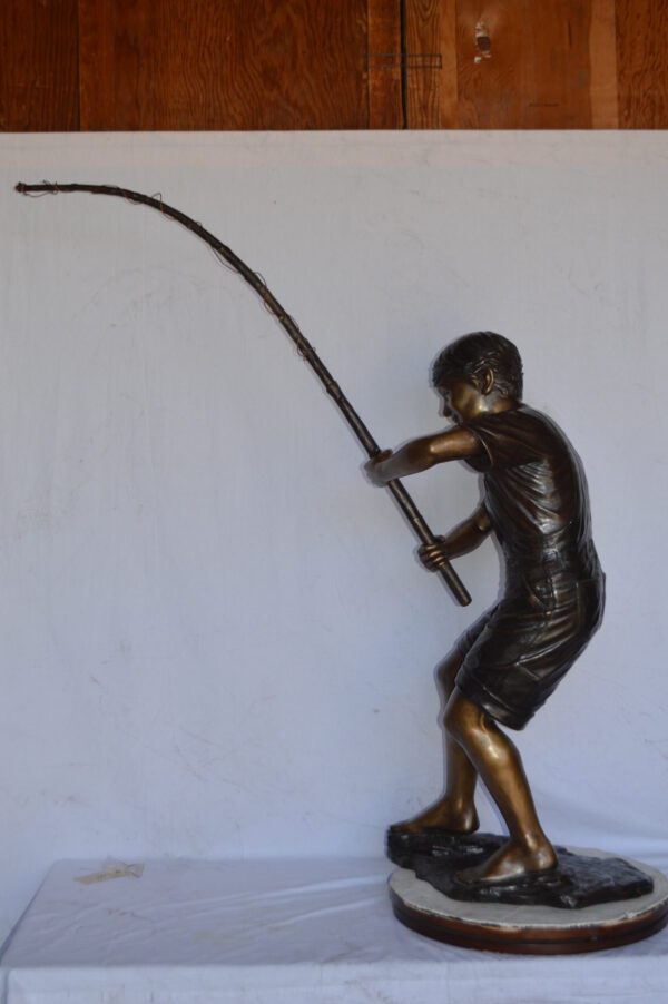 A Young Boy Fishing Bronze Statue - Size: 16"L x 54"W x 62"H. - Image 7
