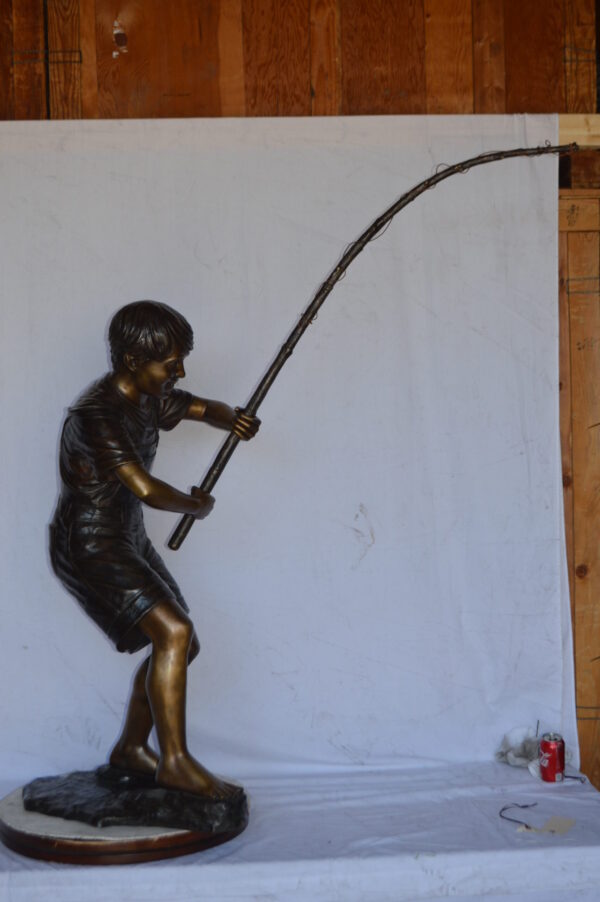 A Young Boy Fishing Bronze Statue - Size: 16"L x 54"W x 62"H. - Image 9