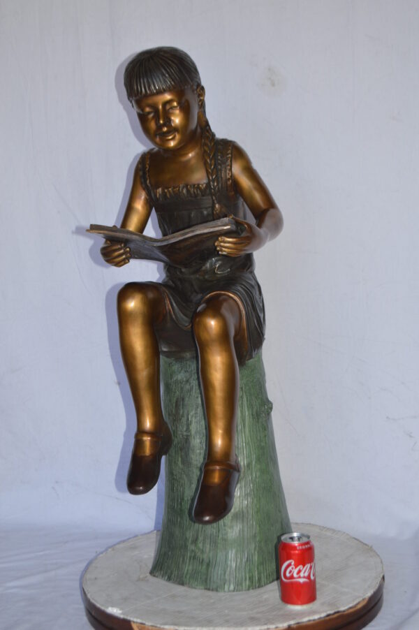Girl Sitting on a Tree Stump, Reading Bronze Statue - Size: 15"L x 20"W x 22"H. - Image 3