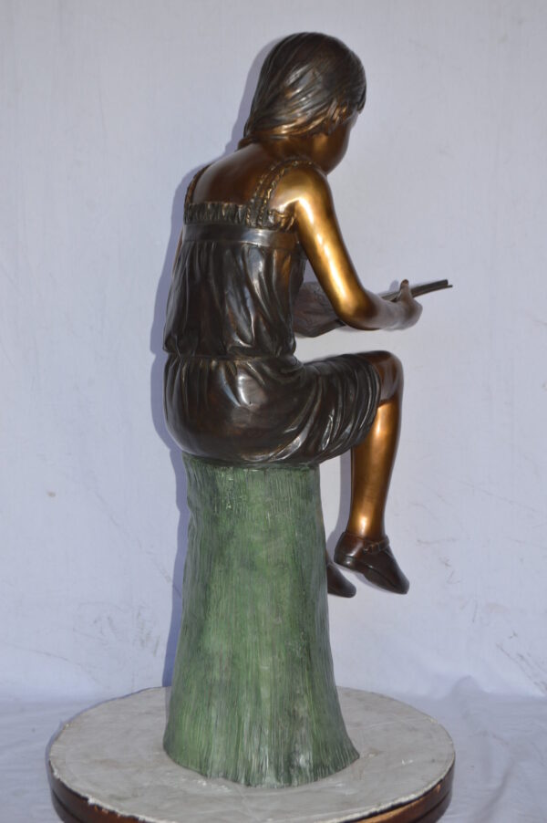 Girl Sitting on a Tree Stump, Reading Bronze Statue - Size: 15"L x 20"W x 22"H. - Image 8