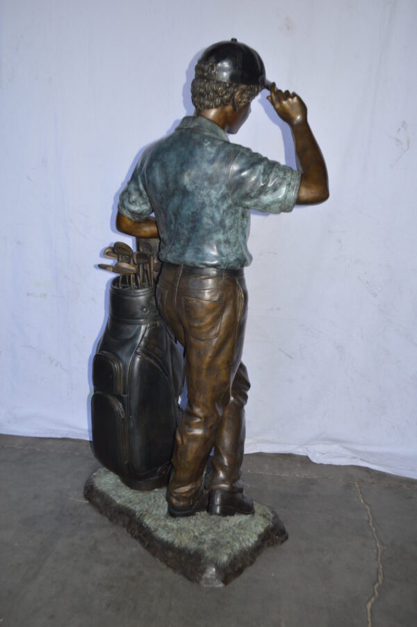 Golfer standing with his gear large bronze Statue - Size: 34"L x 21"W x 65"H. - Image 11