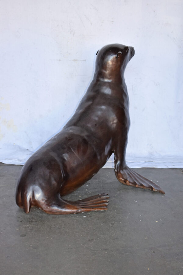 Perched Life Size Seal bronze statue - Size: 40"L x 35"W x 31"H. - Image 6