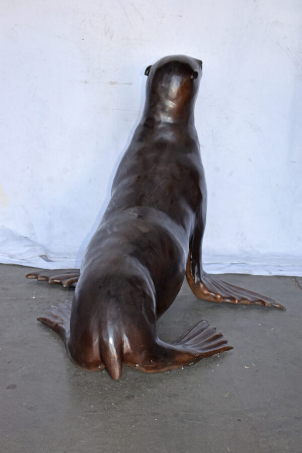 Perched Life Size Seal bronze statue - Size: 40"L x 35"W x 31"H. - Image 7