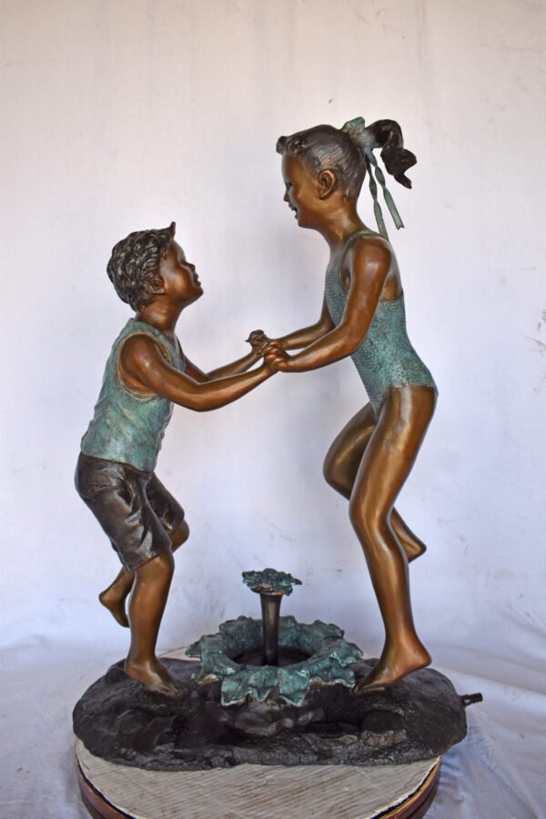 Young Boy and girl dancing around fountain bronze statue-Size 28" x 13" x 38"H - Image 3