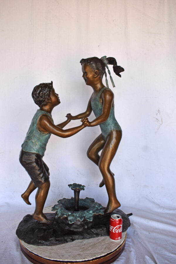 Young Boy and girl dancing around fountain bronze statue-Size 28" x 13" x 38"H - Image 4