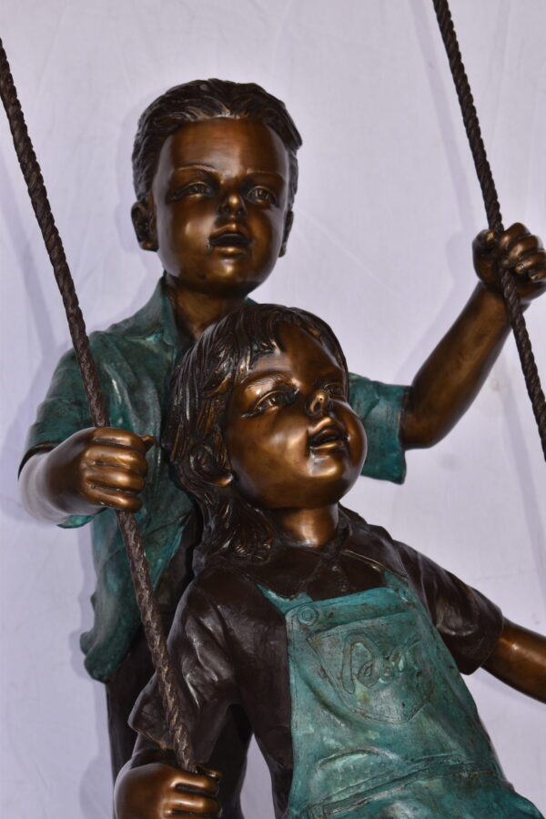 Boy and Girl Playing on a Swing bronze Statue - Size: 39"L x 17"W x 53"H. - Image 8