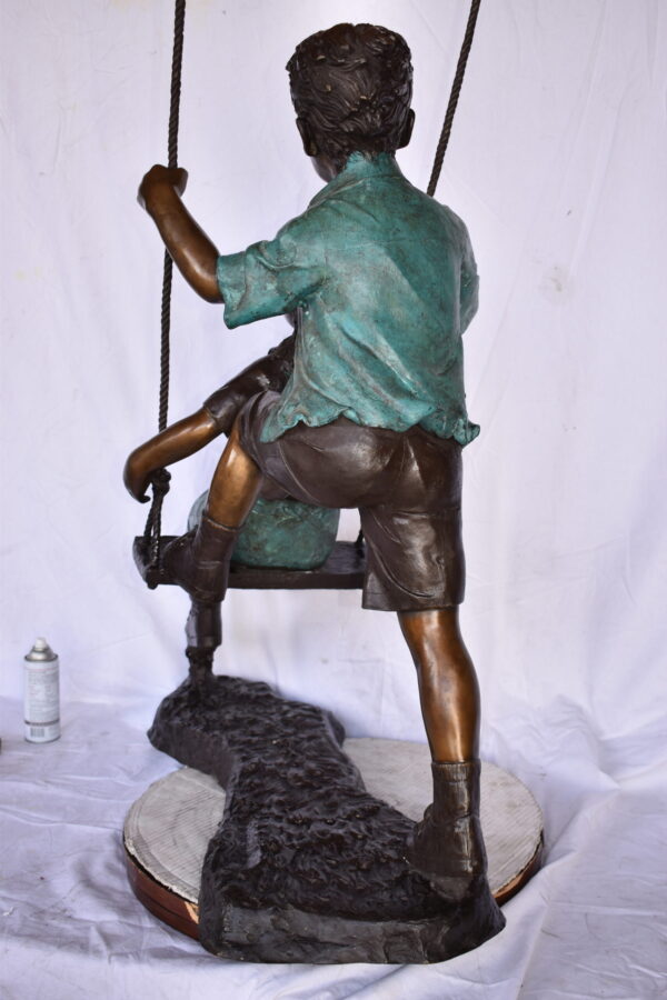 Boy and Girl Playing on a Swing bronze Statue - Size: 39"L x 17"W x 53"H. - Image 12