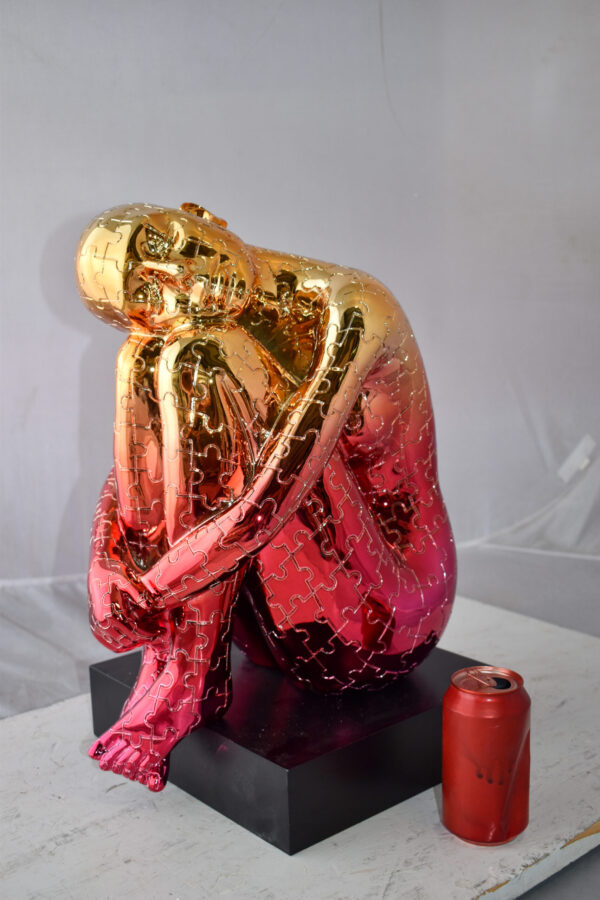 Puzzle Patterned Cradled Woman Resin Statue on Black Base Size: 13" x 12" x 19"H - Image 4
