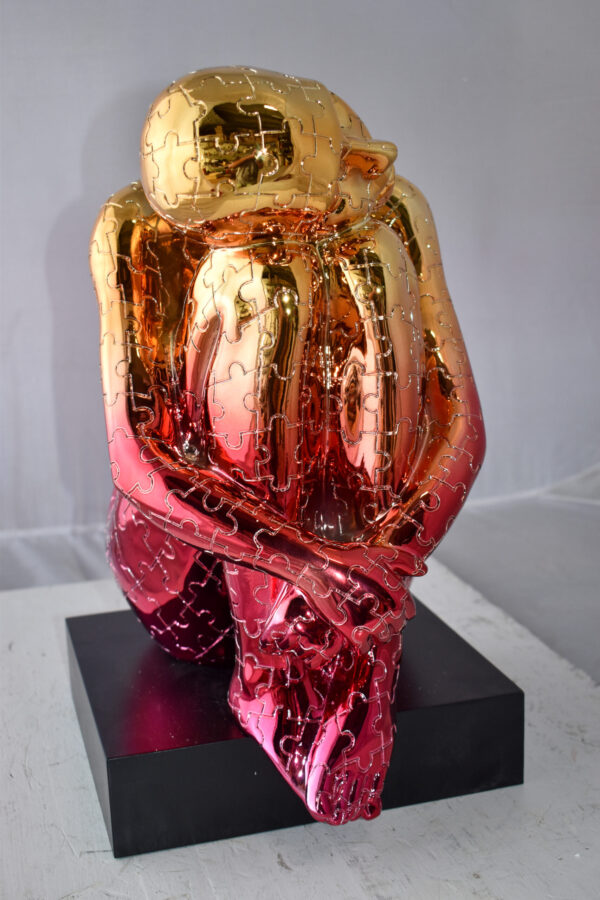 Puzzle Patterned Cradled Woman Resin Statue on Black Base Size: 13" x 12" x 19"H - Image 6