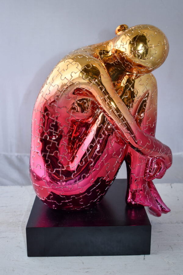 Puzzle Patterned Cradled Woman Resin Statue on Black Base Size: 13" x 12" x 19"H - Image 8