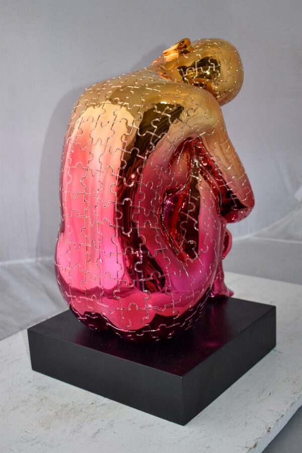 Puzzle Patterned Cradled Woman Resin Statue on Black Base Size: 13" x 12" x 19"H - Image 9