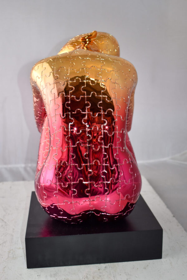 Puzzle Patterned Cradled Woman Resin Statue on Black Base Size: 13" x 12" x 19"H - Image 10
