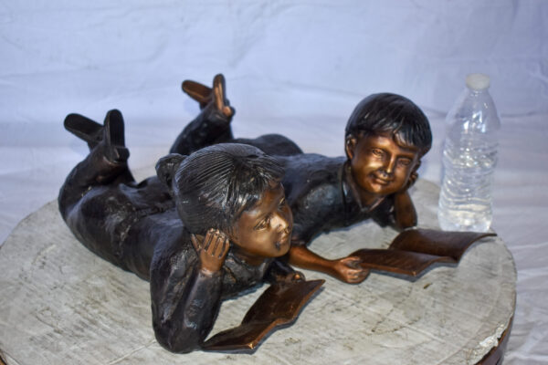 Young Kids Laying and Reading Cheerfully Bronze Statue Set Size: 20" x 13" x 8"H - Image 11